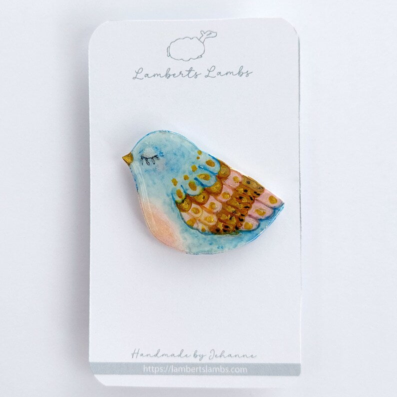 Artsy hand painted light blue, pink and gold bird brooch