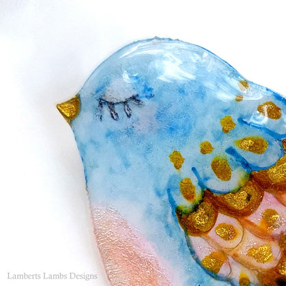 Artsy hand painted light blue, pink and gold bird brooch