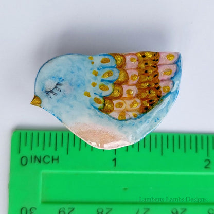 Artsy hand painted light blue, pink and gold bird brooch