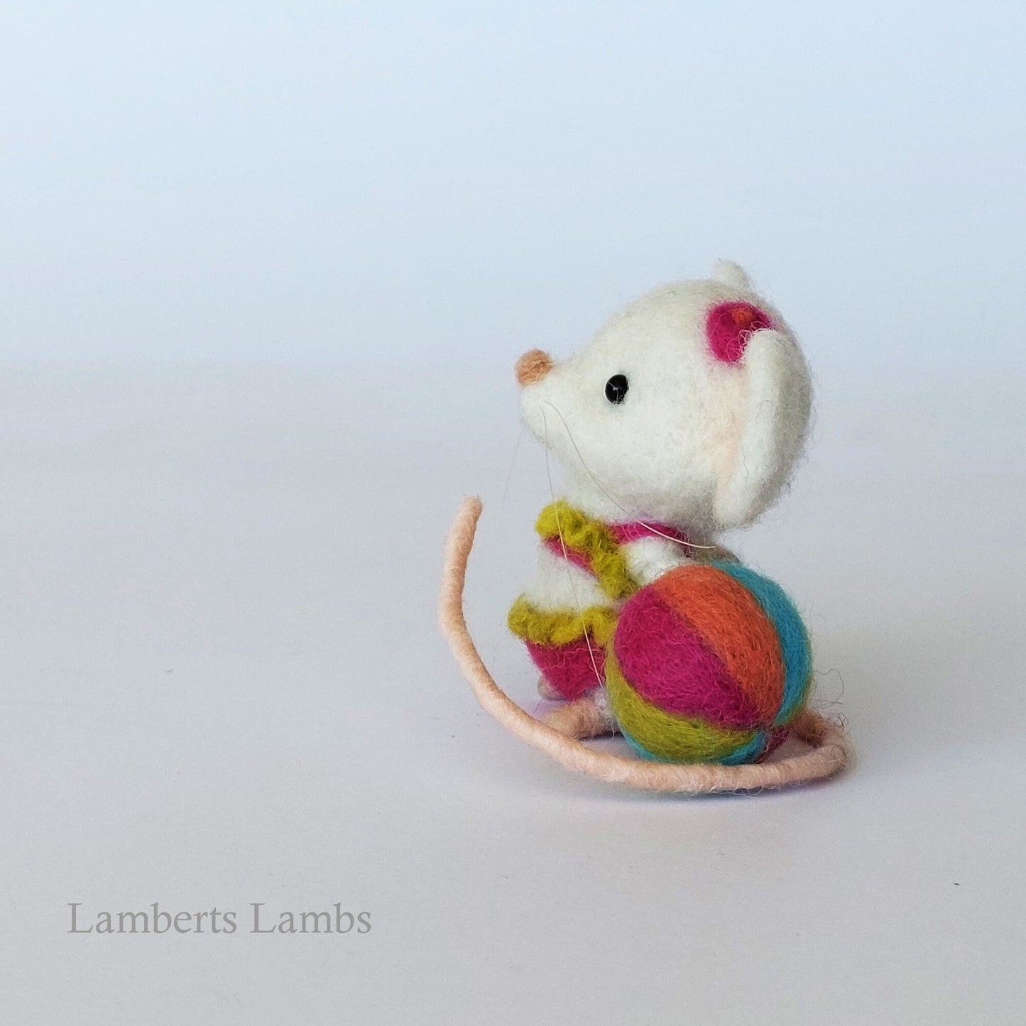White needle felted mouse in a two piece swimsuit with a beach ball. Beach collection . Summer felted mouse.