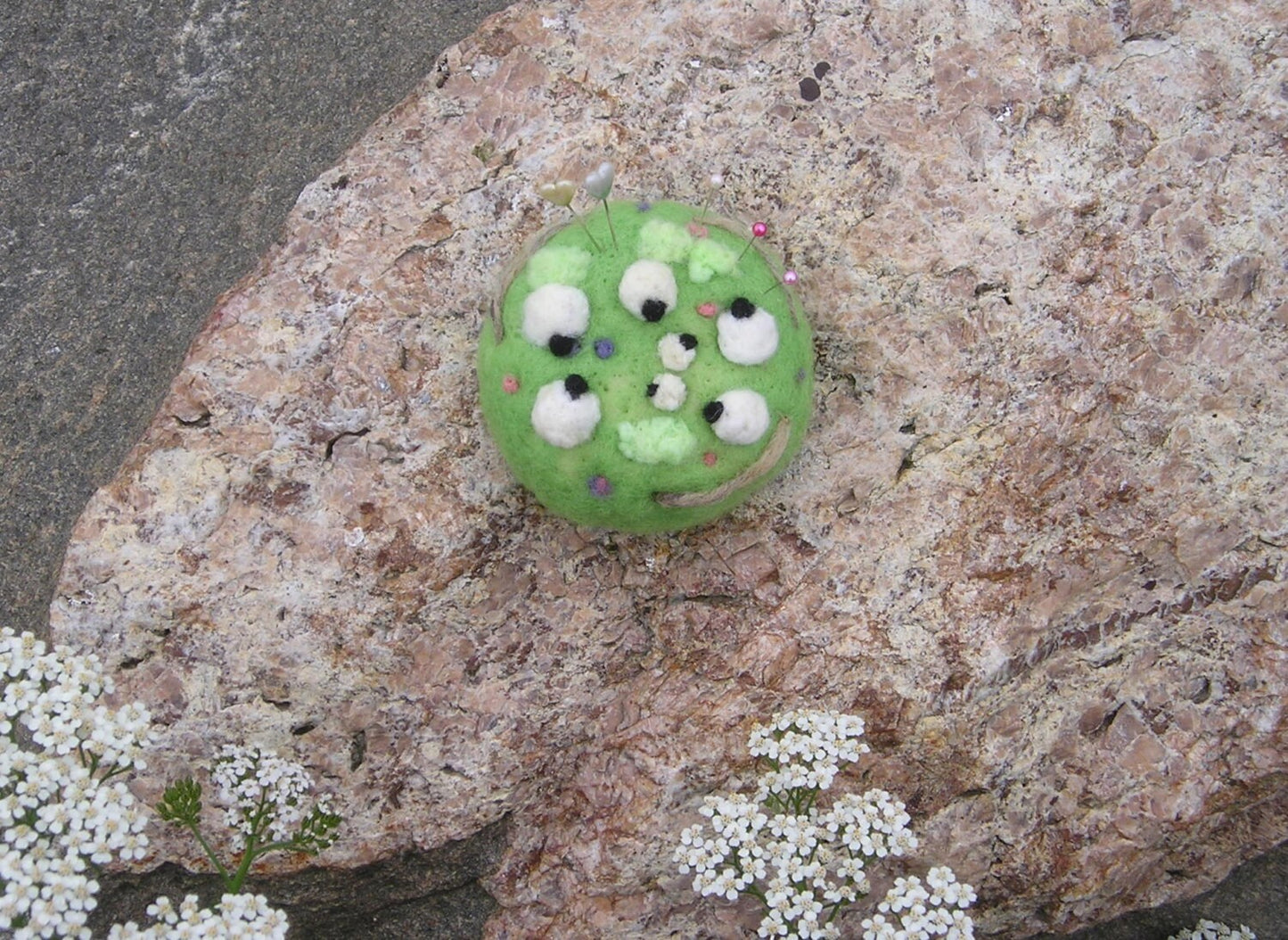Needle felted pin cushion of sheep in the meadow